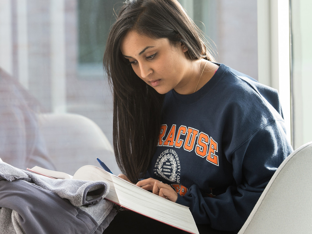 Student studying with a book.