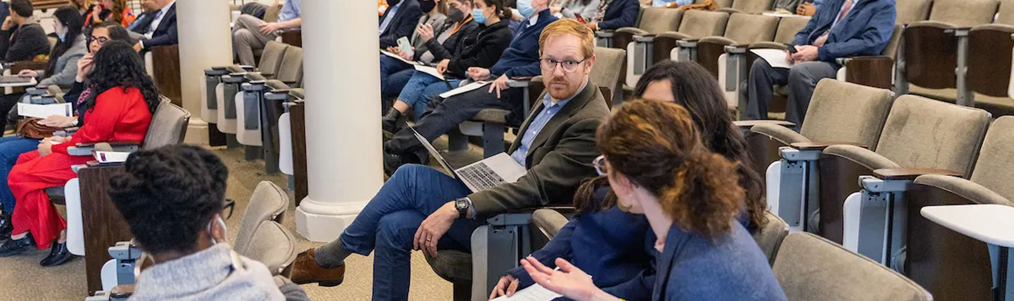 Graduate students engaged in classroom discussion