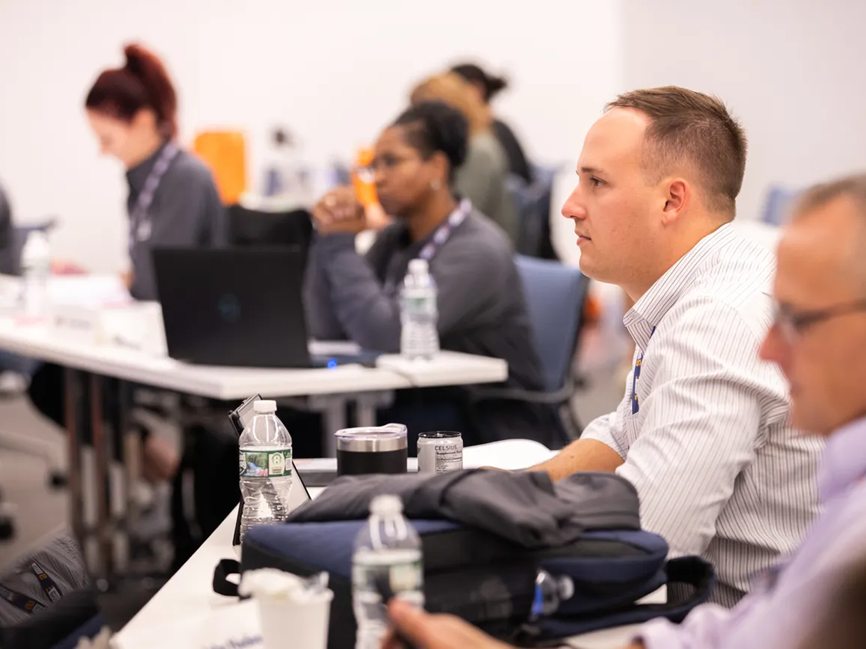 Graduate students engaged in classroom instruction