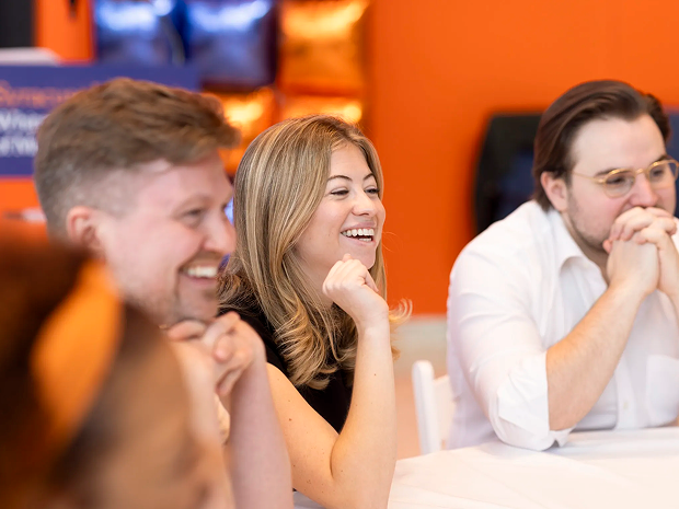 Group smiling during a meeting