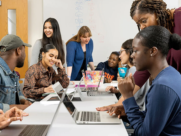 Group of students collaborating in a classroom.